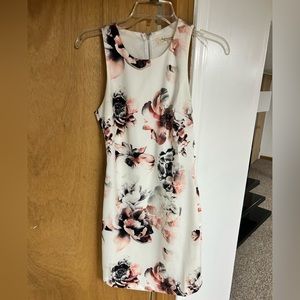 Small white and floral dress with cutouts on the back, long silver zipper